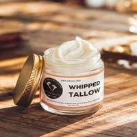 Tallow-Licious Winter Skin Defense Kit featuring whipped tallow in a glass jar with gold lid on wooden surface.