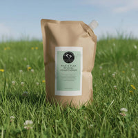 Rice Water Hair Care Refill Kit featuring Rice & Flax Revival Conditioner in eco-friendly packaging on grass.