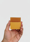 Kojic Acid + Manuka Honey + Turmeric Dark Spot Soap held in a hand, showcasing its natural earthy tones.