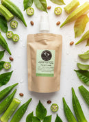 Peptide Facial Care Refill Kit in eco-friendly pouch surrounded by fresh green leaves and natural ingredients.