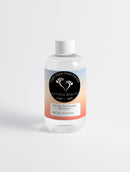 Glycolic Acid Liquid Exfoliator from Eight Bare Feet, featuring a bottle of exfoliating serum designed to smooth and brighten the skin.